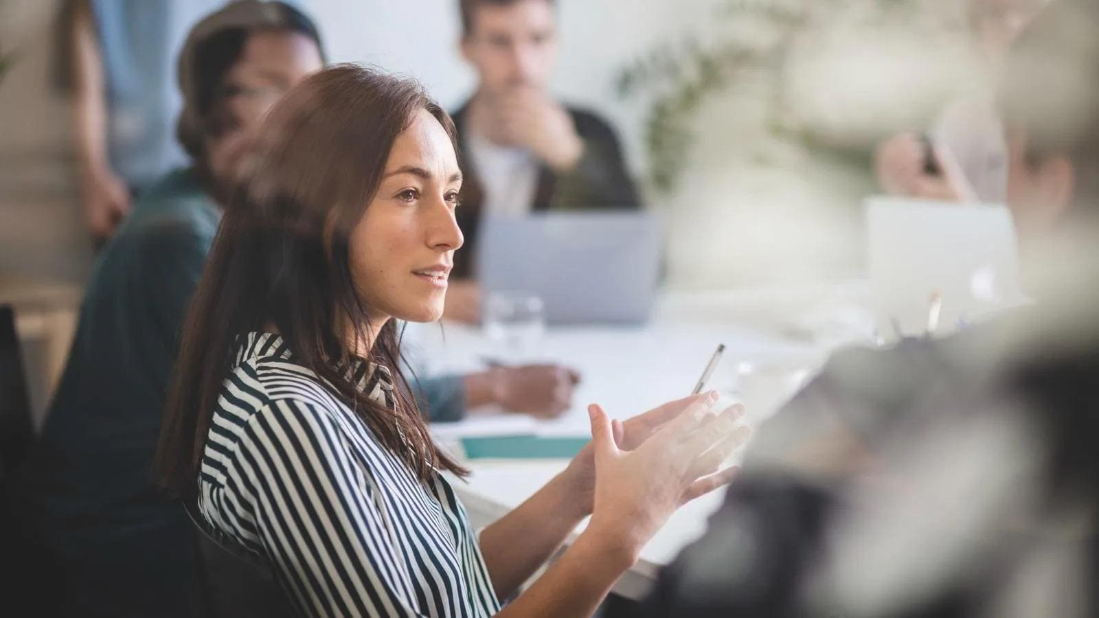 woman talking in business meeting