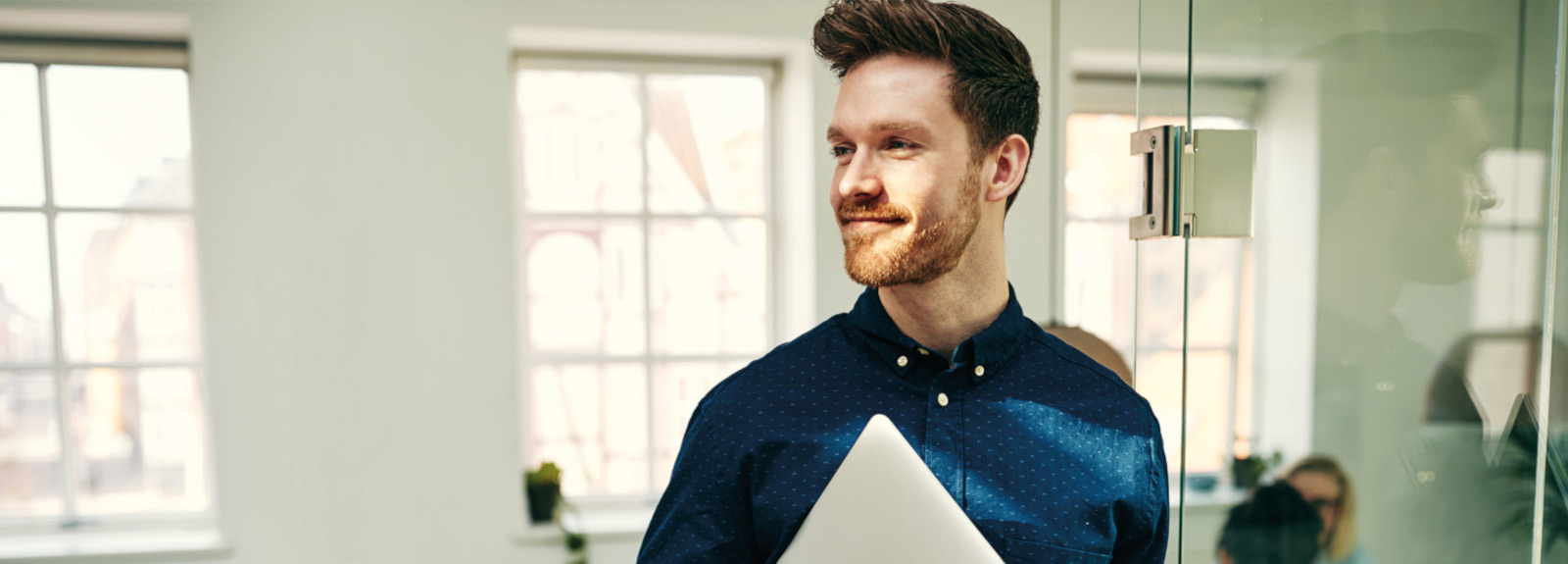 Man holding a Laptop Computer