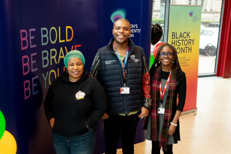 Image shows Students' Union Officer and University staff member, accompanied by a representative from Yetunde's Kitchen, posing for a photograph at the Black History Month event.