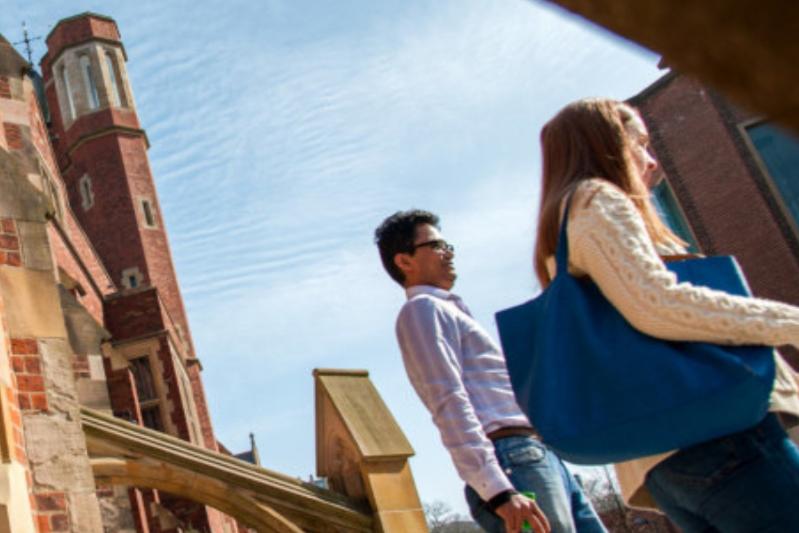 People walking through QUB Campus Grounds