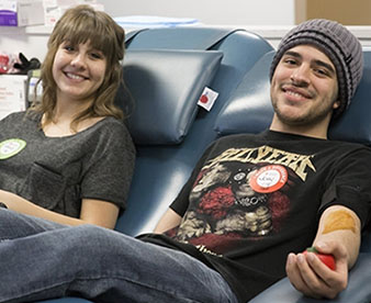 Teens giving blood