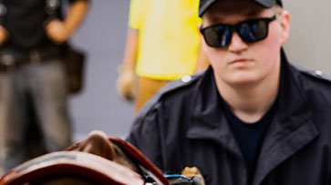 EMS responder treating a patient on a gurney.