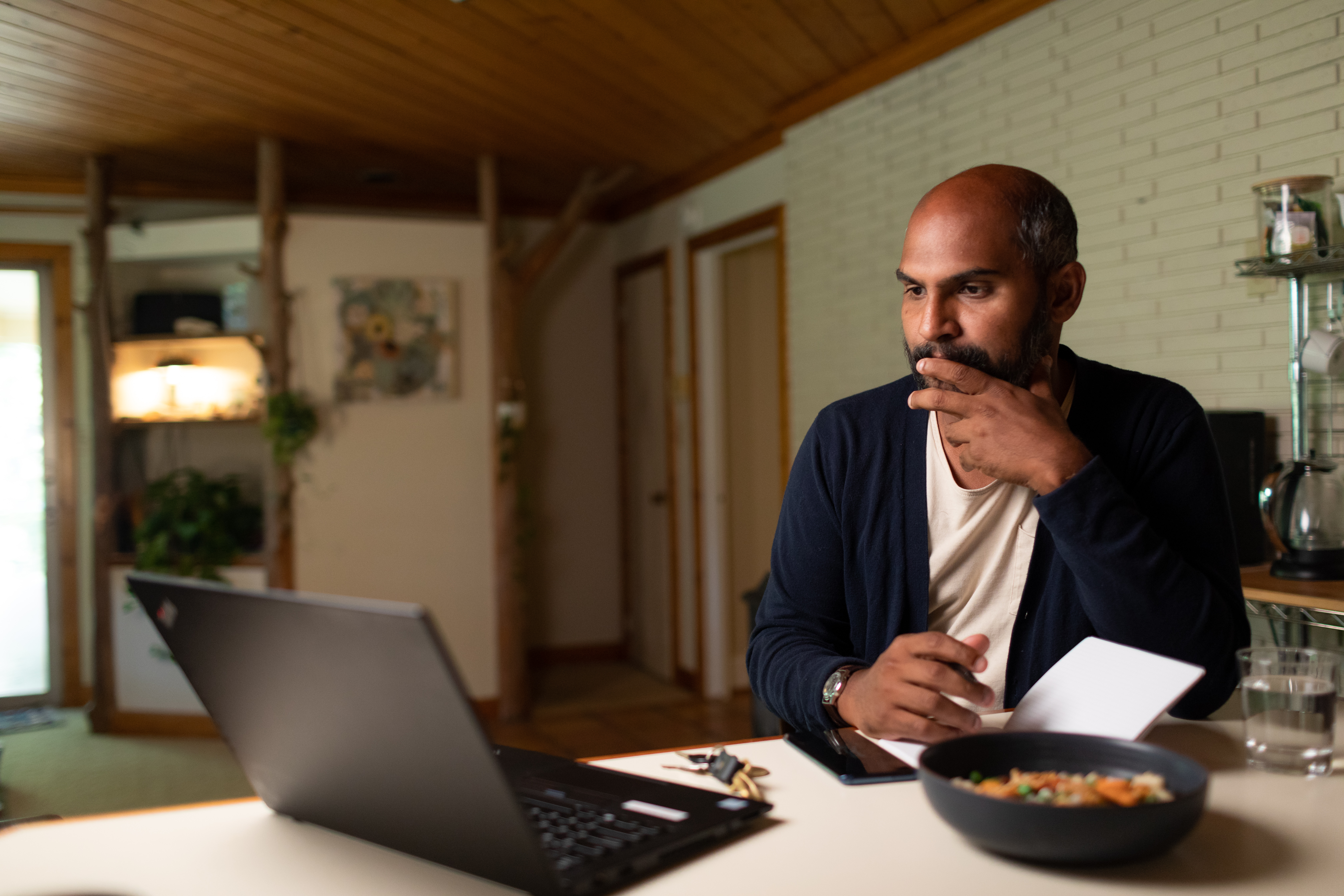 Photo of a man taking notes 