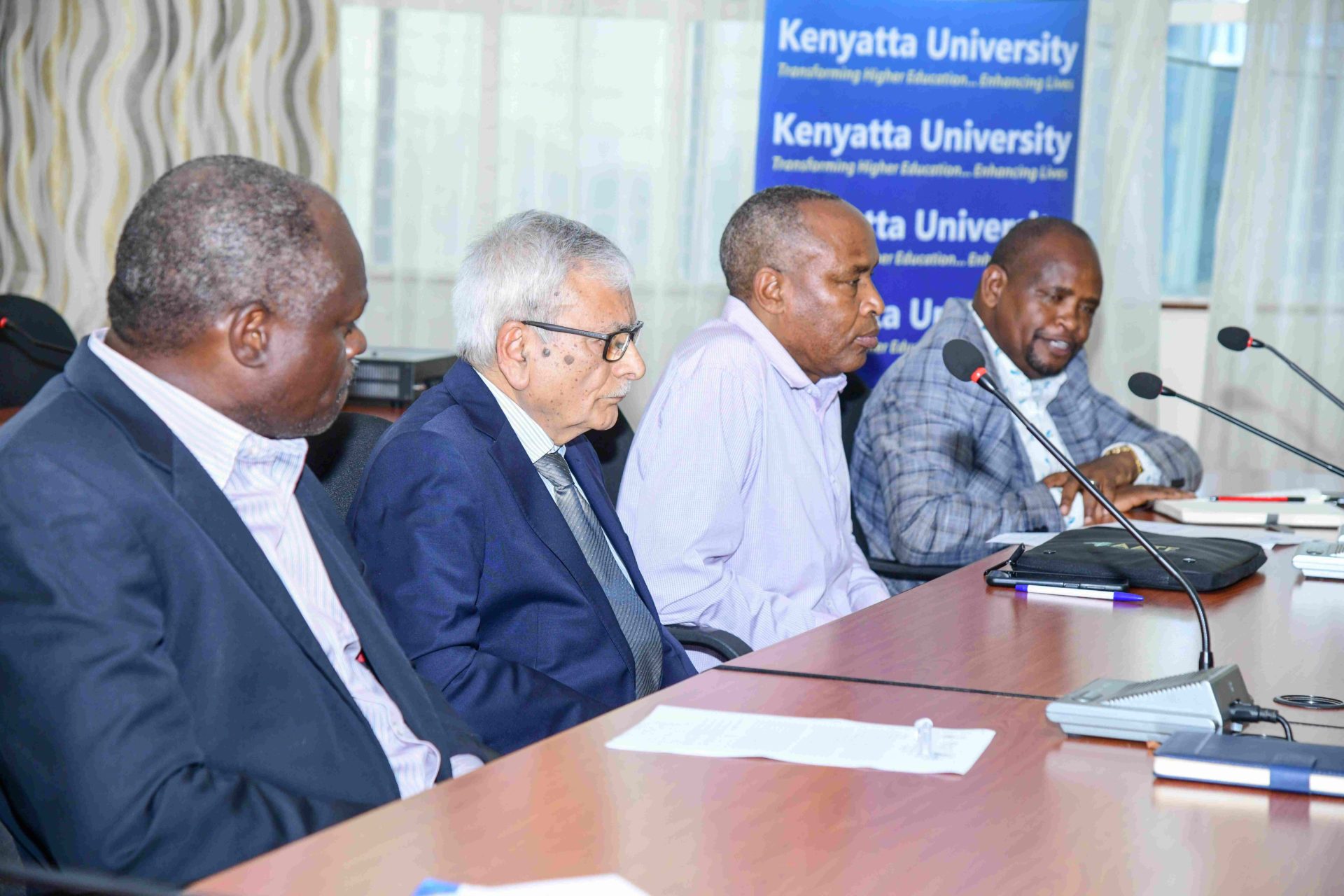 Kenyatta University faculty members follow proceedings of the meeting with Rsif team when they visited the institution.