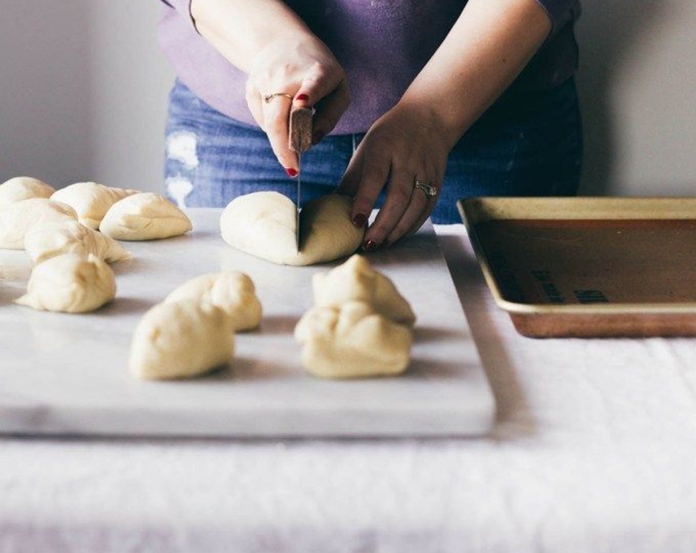 step 6 Take the dough, cut it in half and continue to cut all the pieces in half until you are left with 16 pieces of dough.