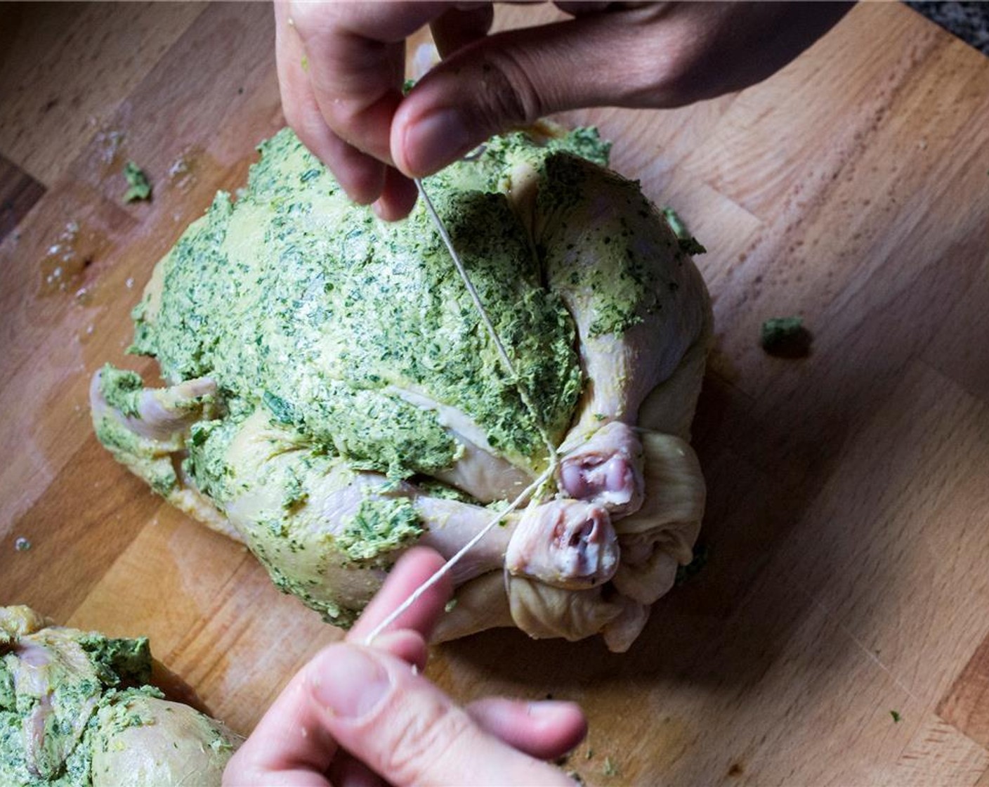 step 5 Using kitchen twine, tie up the hens legs and tail; then tie the wings to the body. Rub the remaining herb-butter mixture over the birds.