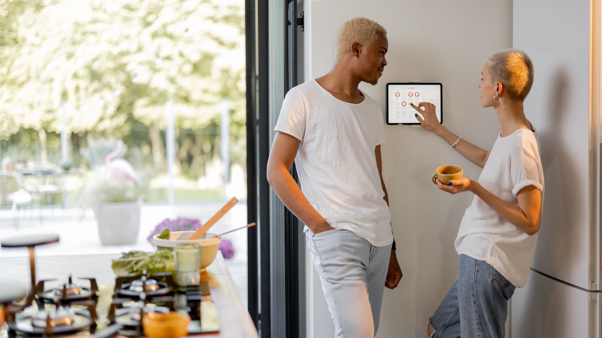 Girl choosing temperature on smart home thermostat.