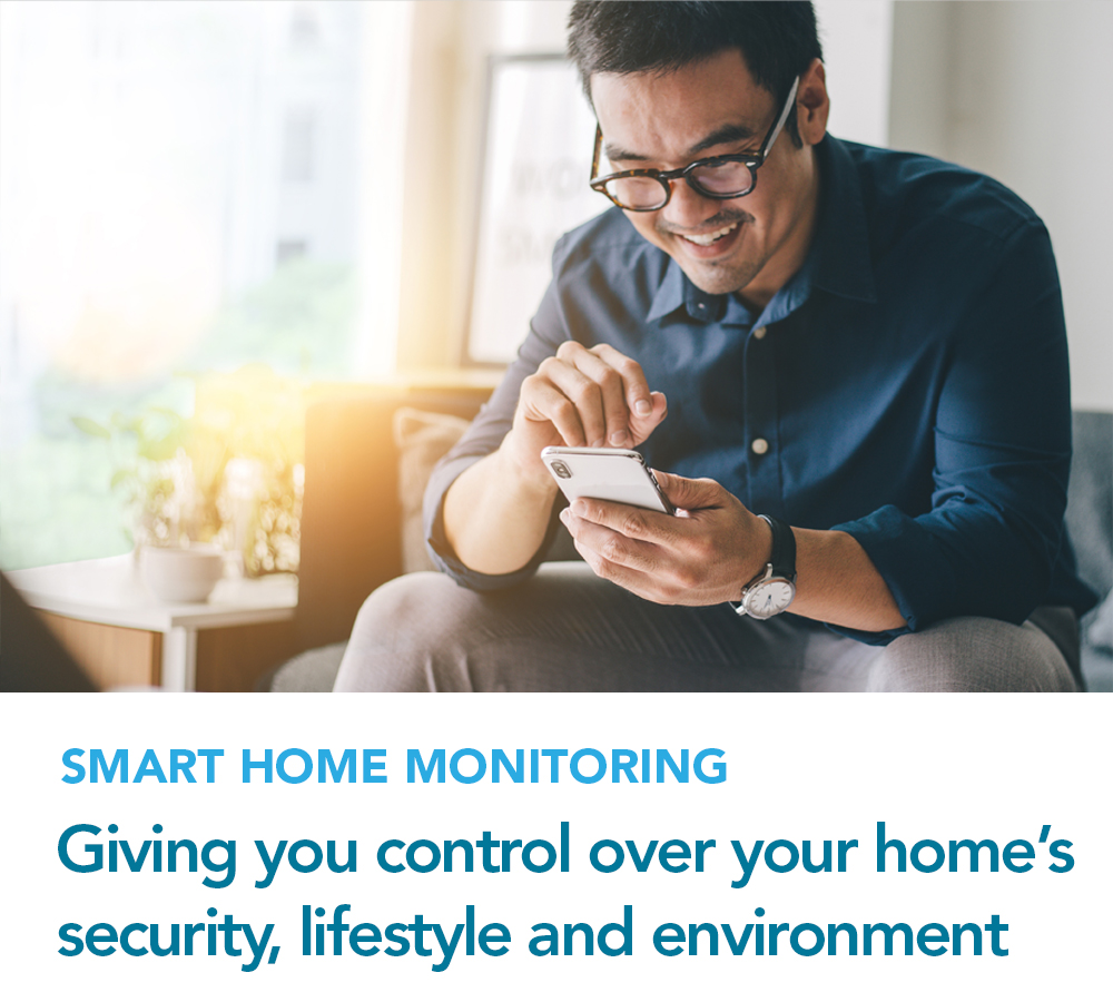 A man using his cell phone to control his home's security system