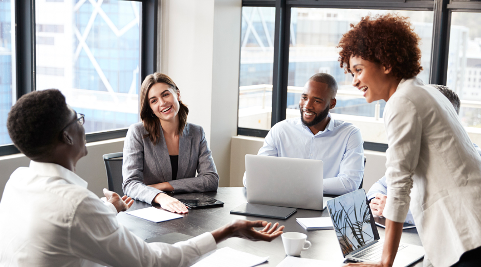 Employees enjoying a conversation at work