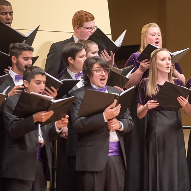 Male and female ensemble singers perform