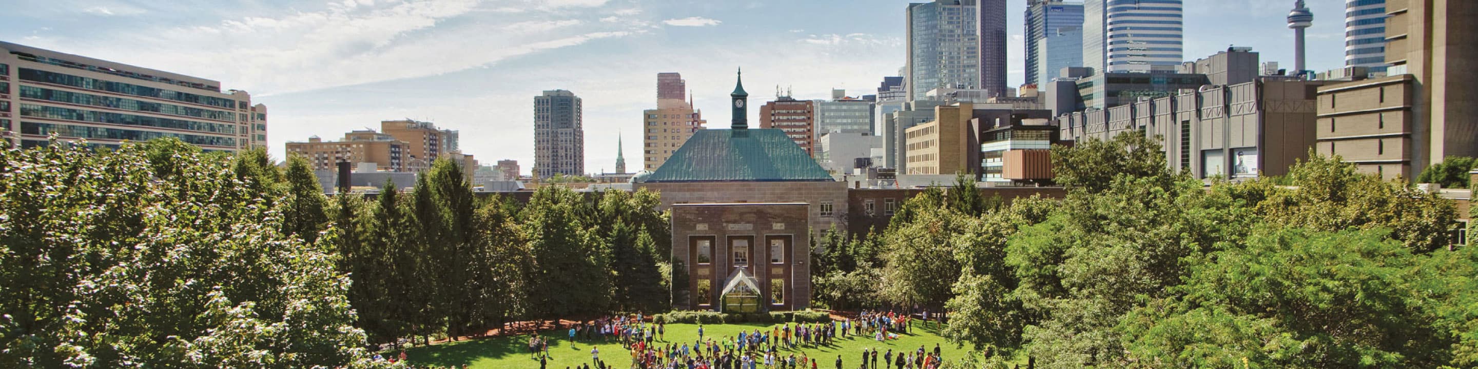 a green quad with CN tower in the background