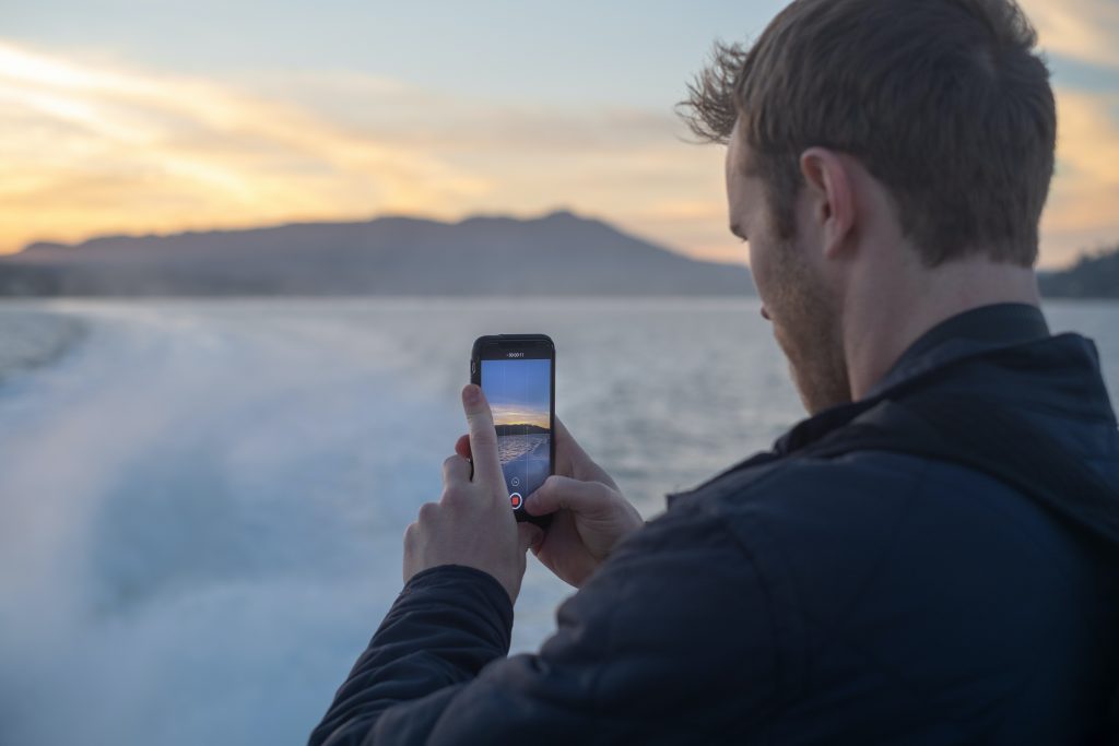 A person is taking photo with his phone.