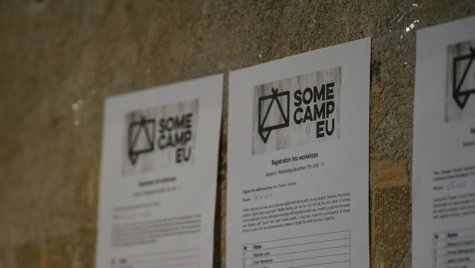 photo of a registration sheet hanging on the wall at the Somecamp EU event