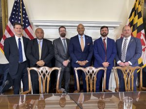 Photo of conservation officials in governor's meeting room.